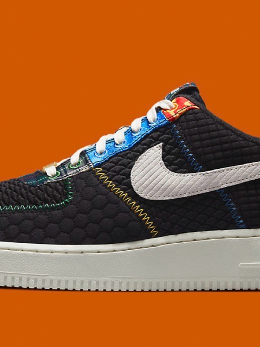 Nike Black Quilted Low-Top Sneakers with White Swoosh and Multicolor Stitching